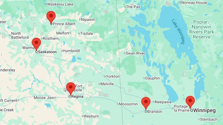 map showing dealer locations across Manitoba and Saskatchewan including Prince Albert, Saskatoon, Regina, Brandon